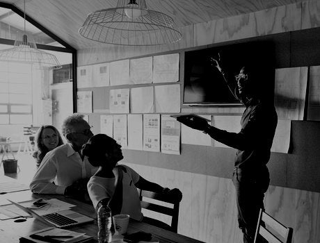 Man doing presentation, using tablet & screen